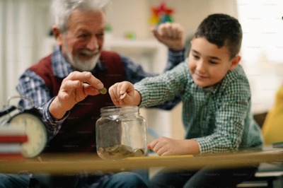 Family Saving Money In Jar